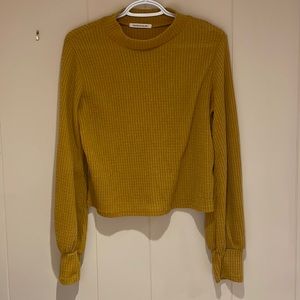 Roughly size M, textured turtle neck with larger sleeves